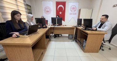 Members of the project team work together at a coordination center to process and fulfill requests submitted by earthquake-affected children, Hatay, Türkiye, Jan. 28, 2026. (AA Photo)