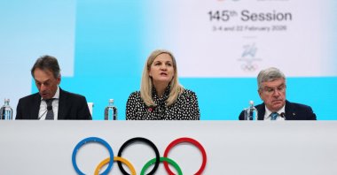 IOC President Kirsty Coventry (C), IOC director general Christophe De Kepper and former IOC president Thomas Bach attend the 145th IOC Session at Auditorium MPC, Milan, Italy, Feb. 4, 2026. (Reuters Photo)