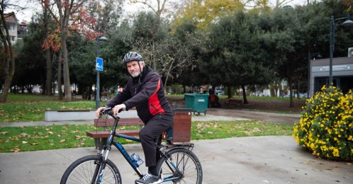 Ahmet Atmaca, the imam of the historic Bebek Mosque, stands with his bicycle, Istanbul, Türkiye, Dec. 10, 2025. (Photo by Sabah's Ceyda Cengiz)