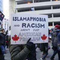 People with posters rejecting racism and Islamophobia during a rally in Toronto, Canada, Feb. 4, 2017. (Shutterstock File Photo)