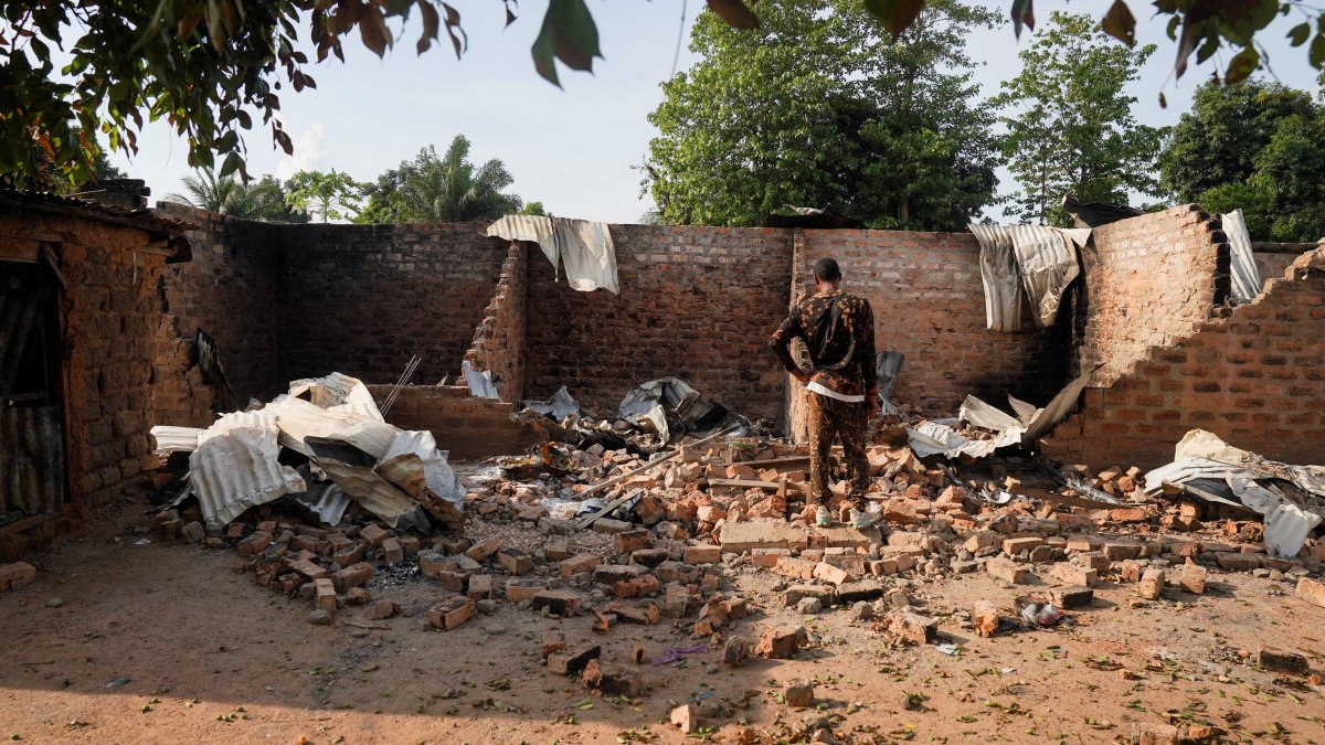 This file photo shows a man standing in front of a damaged and burnt house following a deadly gunmen attack in Yelwata, Benue State, Nigeria, June 16, 2025. (Reuters Photo)