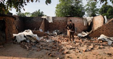 This file photo shows a man standing in front of a damaged and burnt house following a deadly gunmen attack in Yelwata, Benue State, Nigeria, June 16, 2025. (Reuters Photo)