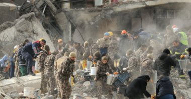 Search and rescue teams and the Provincial Police Department work on a building demolished during the quake, Diyarbakir, Türkiye, Feb. 6, 2023. (AA Photo)