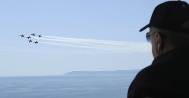 President Recep Tayyip Erdoğan watches jet fighters fly past during the final day of military exercises that were taking place on the Aegean coast, in Seferihisar near Izmir, Türkiye, June 9, 2022. (AP Photo)