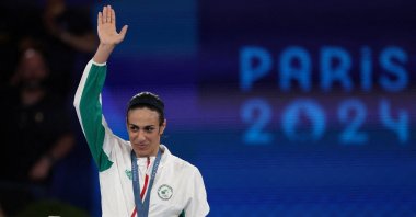 Gold medallist Imane Khelif of Algeria waves with her Paris 2024 Olympics gold medal at the Roland-Garros Stadium, Paris, France, Aug. 9, 2024. (Reuters Photo)