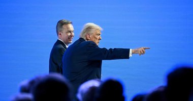 U.S. President Donald Trump (R) gestures flanked by World Economic Forum President and CEO Borge Brende during the World Economic Forum annual meeting in Davos, Switzerland, Jan. 21, 2026. (AFP Photo)