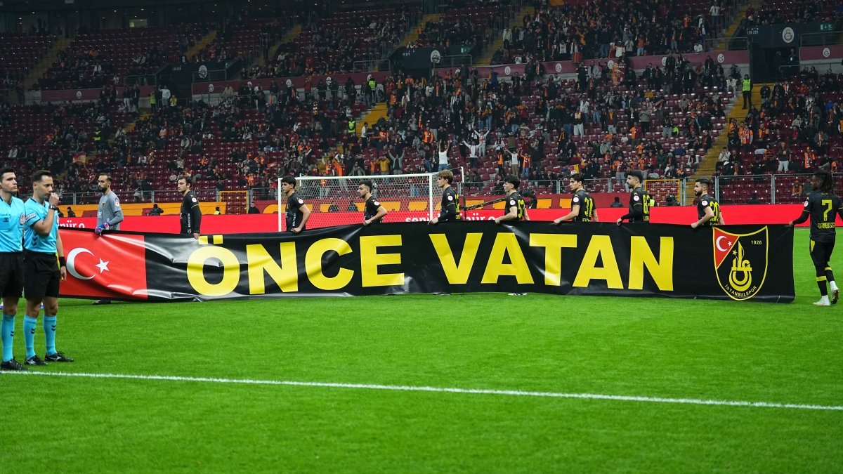 Galatasaray and Istanbulspor players hold a banner reading “Önce Vatan” (Country First) during a moment of remembrance ahead of their Ziraat Türkiye Kupası Group A third-round match at RAMS Park, Istanbul, Türkiye, Feb. 4, 2026. (IHA Photo)