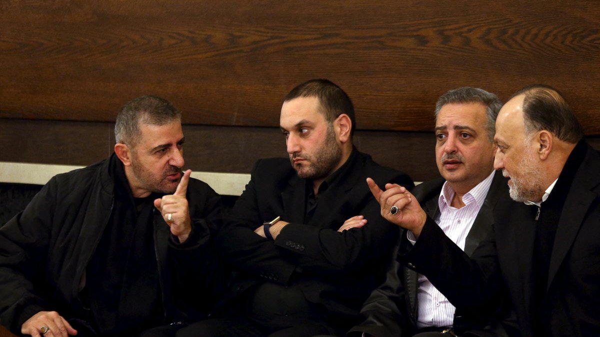 Hezbollah official Wafiq Safa (L) talks Hezbollah parliament member Ali Ammar (R) as Druze Democratic Party chief Talal Arslan (2nd R) looks on after offering their condolences to Bassam Qantar (2nd L), in Beirut's southern suburbs, Lebanon, Dec. 20, 2015. (Reuters File Photo)