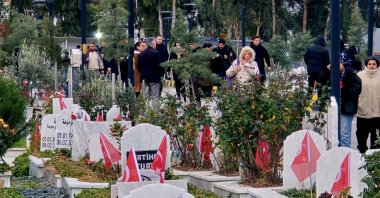 Families visit the graves of loved ones killed in the Feb. 6, 2023, earthquakes, in southeastern Hatay province, Türkiye, Feb. 6, 2026. (DHA Photo)