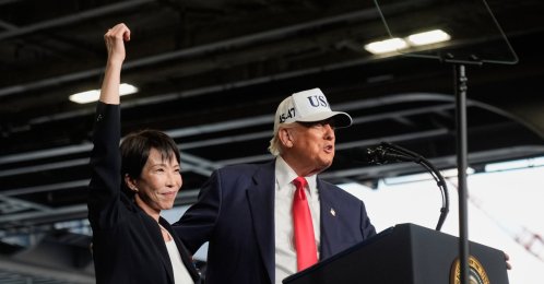 U.S. President Donald Trump (R), with Japanese Prime Minister Sanae Takaichi, speaks to members of the military aboard the USS George Washington, an aircraft carrier docked at an American naval base, Yokosuka, Japan, Oct. 28, 2025. (AP Photo)