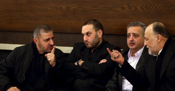 Hezbollah official Wafiq Safa (L) talks Hezbollah parliament member Ali Ammar (R) as Druze Democratic Party chief Talal Arslan (2nd R) looks on after offering their condolences to Bassam Qantar (2nd L), in Beirut's southern suburbs, Lebanon, Dec. 20, 2015. (Reuters File Photo)