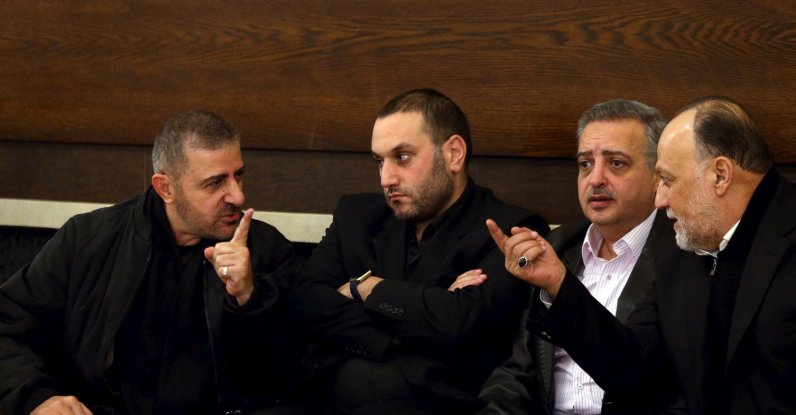 Hezbollah official Wafiq Safa (L) talks Hezbollah parliament member Ali Ammar (R) as Druze Democratic Party chief Talal Arslan (2nd R) looks on after offering their condolences to Bassam Qantar (2nd L), in Beirut's southern suburbs, Lebanon, Dec. 20, 2015. (Reuters File Photo)
