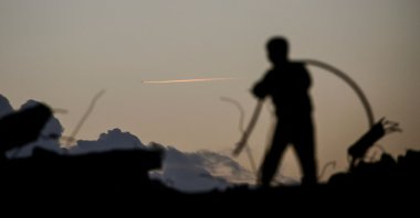 A person is silhouetted while standing on the rubble in the Bureij refugee camp in the central Gaza Strip, Palestine, Feb. 3, 2026. (AFP Photo)