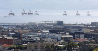 Early morning sea fog shrouds construction container cranes at the Port of Cape Town, Cape Town, South Africa, Jan. 27, 2026. (Reuters Photo)