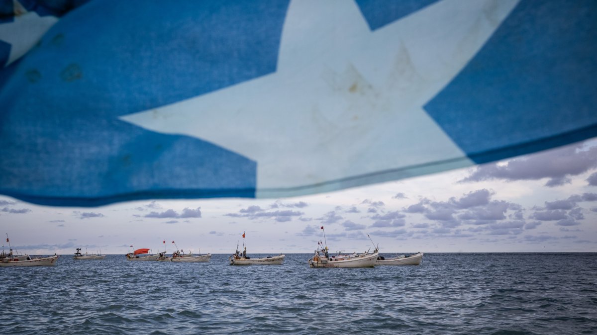 A Somali flag flies from a tourist boat as people swim and spend time on Lido beach, Mogadishu, Somalia, April 25, 2025. (Getty Images)