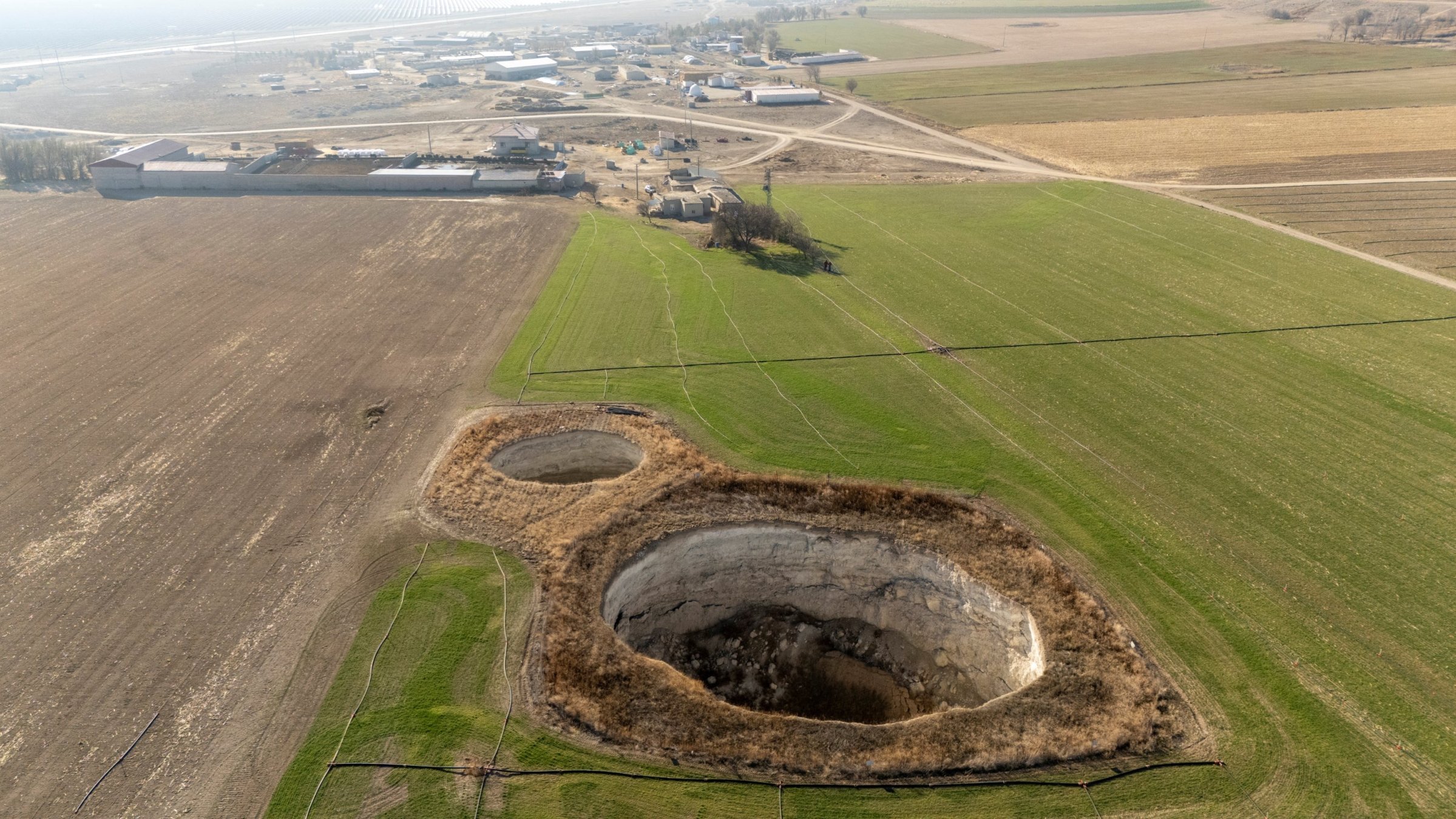 A drone view shows sinkholes formed in the middle of a farmland in Konya province, Türkiye, Dec. 18, 2025. (Reuters Photo)

