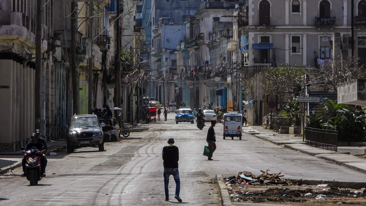 People walk along a quiet street in Havana, Cuba, Feb. 8, 2026. (AFP Photo)
