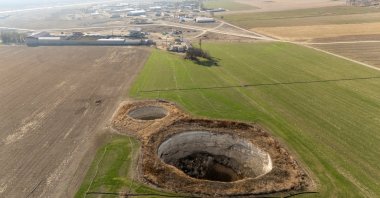 A drone view shows sinkholes formed in the middle of a farmland in Konya province, Türkiye, Dec. 18, 2025. (Reuters Photo)
