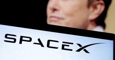 SpaceX's logo and an Elon Musk photo are seen in this illustration created Dec. 19, 2022. (Reuters File Photo)