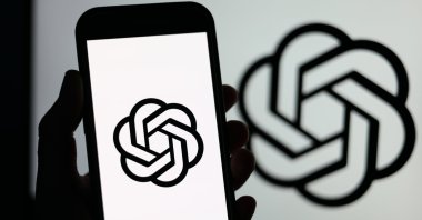 The ChatGPT logo displayed on a mobile phone and on a laptop screen in Liverpool, Britain, Jan. 23, 2026. (EPA File Photo)