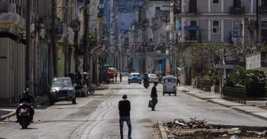 People walk along a quiet street in Havana, Cuba, Feb. 8, 2026. (AFP Photo)