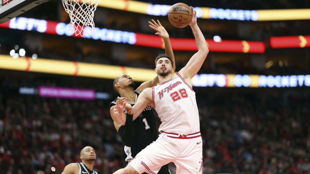 Houston Rockets' Alperen Şengün (R) attempts to control the ball as San Antonio Spurs forward Victor Wembanyama defends during the second quarter at Toyota Center, Houston, U.S., Jan. 28, 2026. (Reuters Photo)
