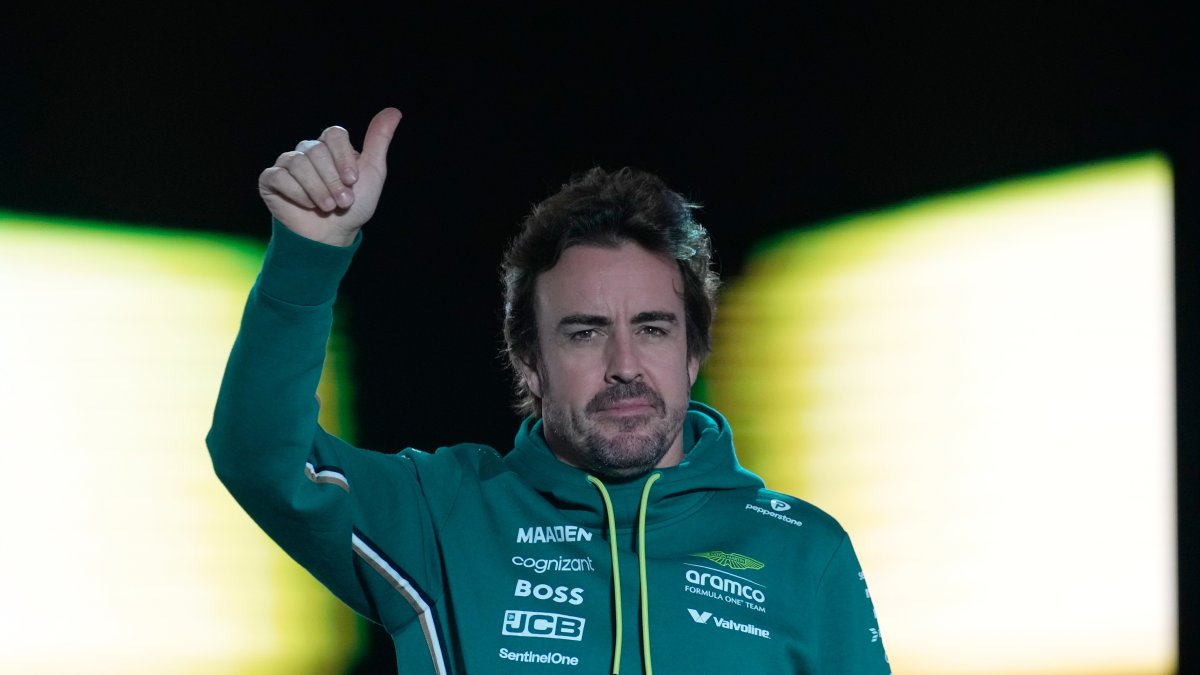 Aston Martin driver Fernando Alonso of Spain reacts as he arrives for the drivers’ parade ahead of the Qatar Formula One Grand Prix, Lusail, Qatar, Nov. 30, 2025. (AP Photo)
