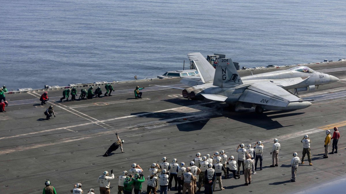 Observers, including U.S. lead negotiators Steve Witkoff and Jared Kushner are seen as they watch flight operations on the flight deck of Nimitz-class aircraft carrier USS Abraham Lincoln (CVN 72) in the Arabian Sea, Feb. 7, 2026. (US Navy Handout via AFP)