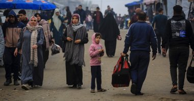 Palestinians walk down a road in Khan Younis, in the southern Gaza Strip, Palestine, Feb. 10, 2026. (AFP Photo)