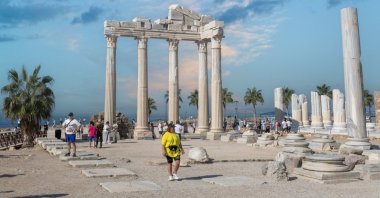 Tourists are walking in the Side Old Town, Antalya, Türkiye, Oct. 24, 2025. (Shutterstock Photo)