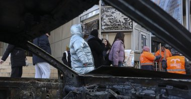 Ukrainian people and communal workers inspect the damage at the site of a Russian strike in Odesa, southwestern Ukraine, Feb. 9, 2026. (EPA Photo)