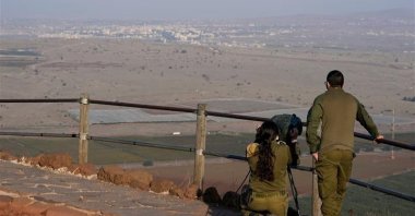 Israeli soldiers observe al-Qunaitra across the border from Mount Bental in the Israeli-occupied Golan Heights, Syria, Nov. 19, 2020. (AP Photo)