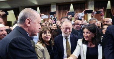 President Recep Tayyip Erdoğan is seen shaking hands with DEM Party lawmaker Pervin Buldan at a reception at Parliament, Ankara, Türkiye, Oct.1, 2025 (AA Photo)