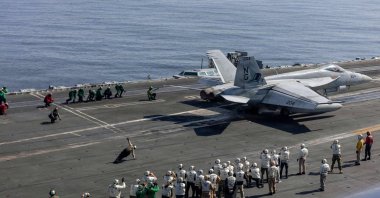 Observers, including U.S. lead negotiators Steve Witkoff and Jared Kushner are seen as they watch flight operations on the flight deck of Nimitz-class aircraft carrier USS Abraham Lincoln (CVN 72) in the Arabian Sea, Feb. 7, 2026. (US Navy Handout via AFP)