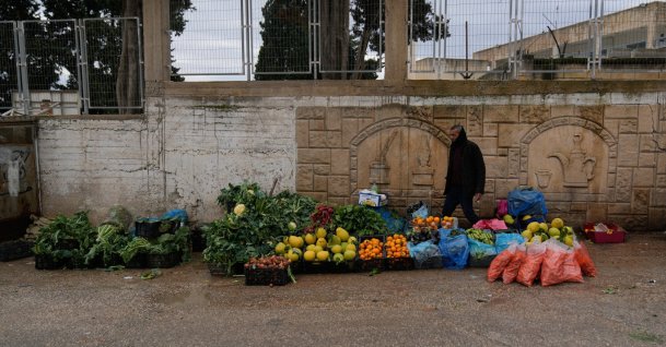 A Palestinian street vendor displays fruits and vegetables for sale in the West Bank city of Tulkarem, Palestine, Jan. 18, 2026. (AP Photo)