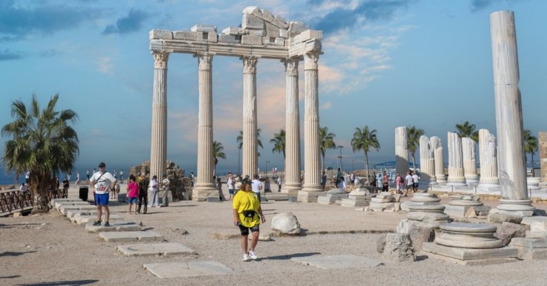 Tourists are walking in the Side Old Town, Antalya, Türkiye, Oct. 24, 2025. (Shutterstock Photo)