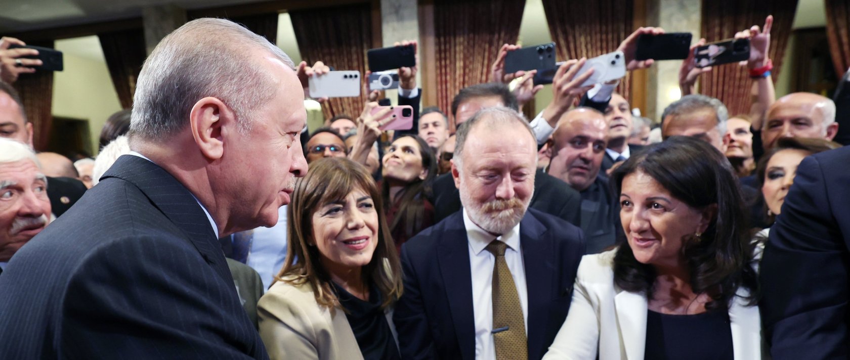 President Recep Tayyip Erdoğan is seen shaking hands with DEM Party lawmaker Pervin Buldan at a reception at Parliament, Ankara, Türkiye, Oct.1, 2025 (AA Photo)