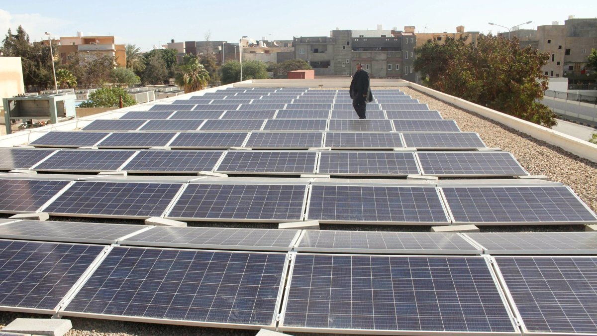 A man stands among solar panels installed by the United Nations Development Programme (UNDP) at Abu Salem hospital, Tripoli, Libya, Jan. 29, 2017. (Reuters Photo)