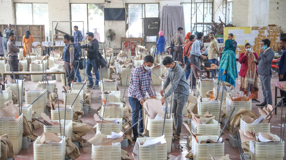 Election officials prepare voting materials and ballot boxes at a distribution center in Dhaka, Bangladesh, Feb. 11, 2026. (EPA Photo)