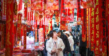 People buy decorations in preparation for the Spring Festival, Shenyang, China, Feb. 4, 2026. (AFP Photo)