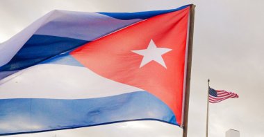 A Cuban flag waves in front of a U.S. flag, Havana, Cuba, Jan. 16, 2026. (AFP Photo)