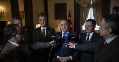 Turkish Parliament's Foreign Affairs Committee Chair Fuat Oktay (C) speaks to journalists at the Turkish Embassy residence in Washington, D.C., U.S., Feb. 11, 2026. (AA Photo)