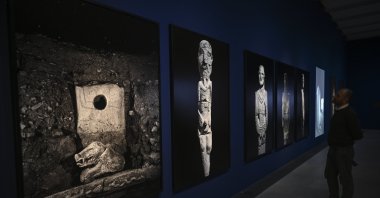 A visitor explores the “Building Community: Göbeklitepe, Taş Tepeler and Life 12,000 Years Ago” exhibition, Berlin, Germany, Feb. 5, 2026. (AA Photo)