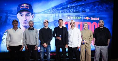 National rider Toprak Razgatlioglu (C) poses for a commemorative photo with fellow athletes ahead of the premiere of the documentary “El Turco: Toprak Razgatlioglu,” which chronicles his journey from World Superbike champion to MotoGP, at Terminal Kadikoy, Istanbul, Türkiye, Feb. 10, 2026. (AA Photo)