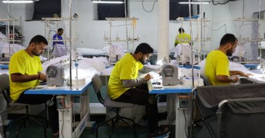 Migrant workers from India sew tulle fabric at a textile factory in the town of Balashikha outside Moscow, Russia, Jan. 20, 2026. (Reuters Photo)