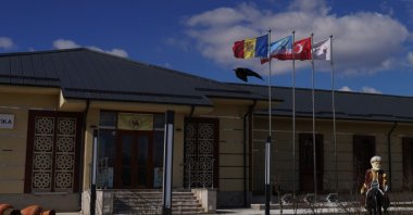 Moldovan, Gagauz and Turkish flags fly on a kindergarten, Comrat, Moldova, March 17, 2022. (Getty Images Photo)
