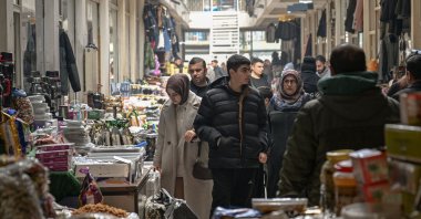 People walk through a market in Van, eastern Türkiye, Feb. 2, 2026. (AFP Photo)
