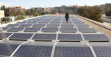 A man stands among solar panels installed by the United Nations Development Programme (UNDP) at Abu Salem hospital, Tripoli, Libya, Jan. 29, 2017. (Reuters Photo)