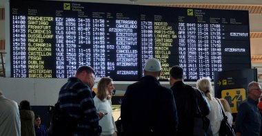Passengers stand near information panels at Bilbao Airport, Loiu, Spain, Oct. 9, 2024. (Reuters Photo)