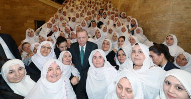 President Recep Tayyip Erdoğan pose with Mayor Zeynep Güneş and women dressed like her in a display of solidarity, Ankara, Türkiye, Feb. 11, 2026. (AA Photo)